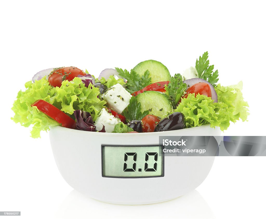 Diet meal Diet meal. Vegetables salad in a bowl with digital weight scale Adult Stock Photo