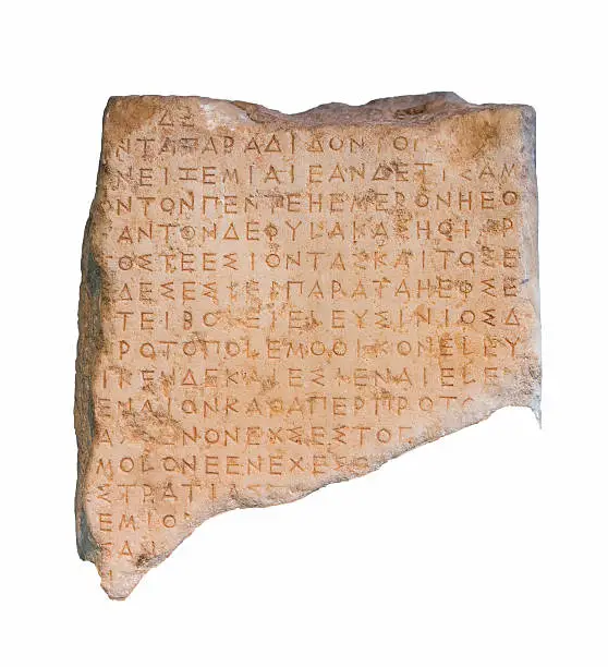 Fragment of an ancient Greek inscribed stele from ancient Eleusis, Attica, isolated