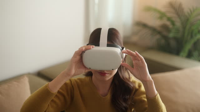 Attractive Woman Explore VR in Cozy Living Room.