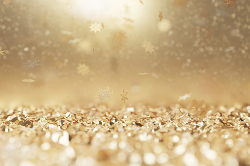 3D rendering of lying golden christmas particles and snow crystals. Holiday celebration background