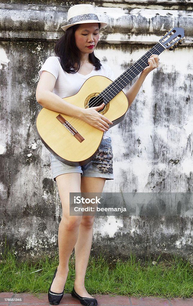 woman with guitar portrait of woman with guitar Acoustic Guitar Stock Photo