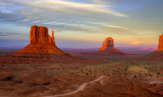 Buttes in Monument Valley, Arizona, during the bi-annual Mitten Shadow Event, when the West Mitten Butte casts it's shadow upon East Mitten Butte at sunset.