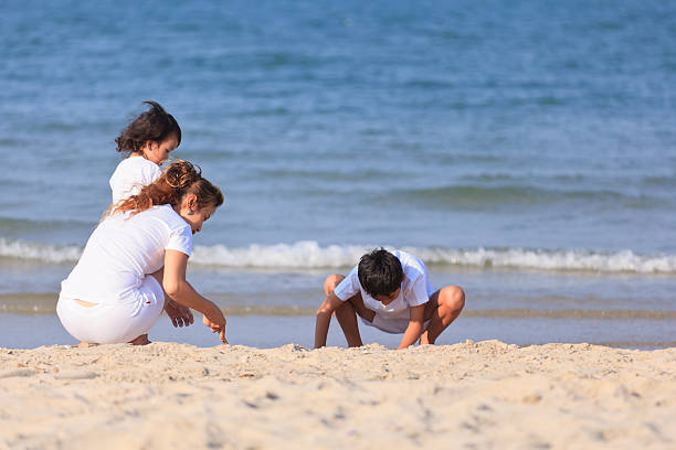 istock Asian family on beach 178551475