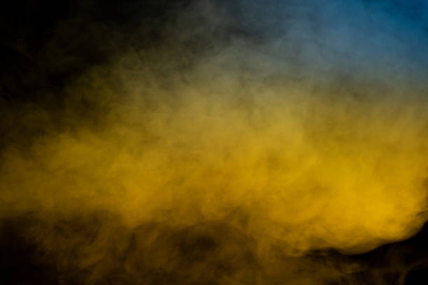istock Yellow steam on a black background. 1785520181