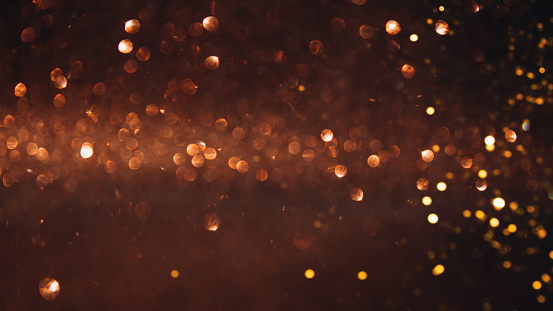 Photography of defocused golden lights (bokeh) on a dark blue background. Great background for Websites, Christmas and many more. Native image size: 13000x5304