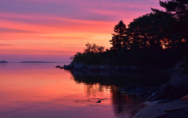 istock Gorgeous Silhouetted Sunrise With Colors Along the Coastline 1785530379