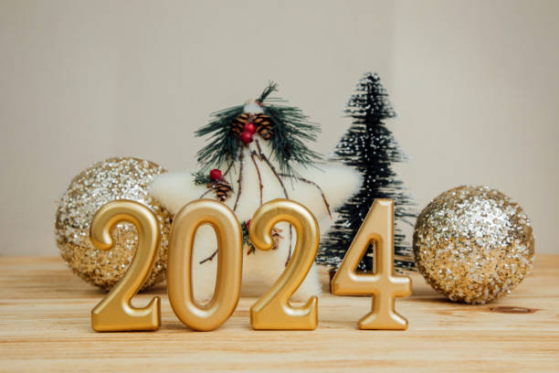 istock Background for greetings with empty space. Christmas toys, stars and pine cones, on a light wooden background 1785531034