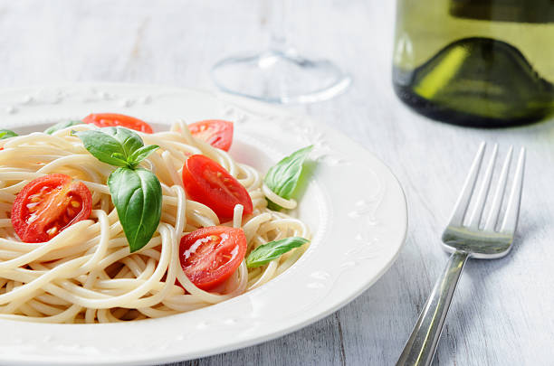 istock Simple pasta meal with tomatoes and greens 178553119