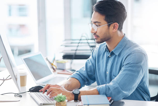 istock Computer, business and man typing, planning and feedback for report, proposal and reading emails. Male entrepreneur, employee and consultant in workplace, pc and device for search internet and online 1785538630