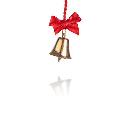 Christmas golden bell on red ribbon and bow isolated on white background