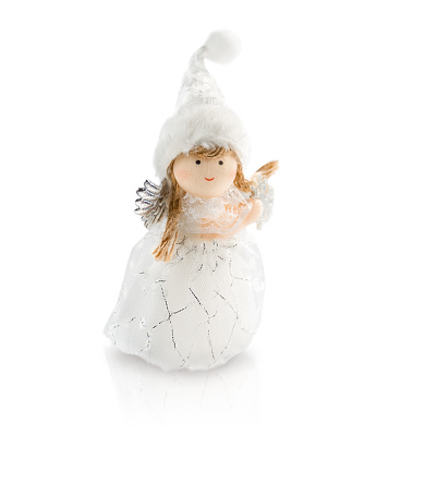 Angel toy in white dress and cap isolated on white background