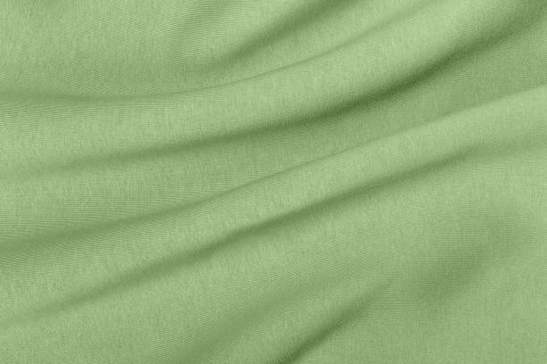 istock Thick warm draped green jersey for winter background 1785541340