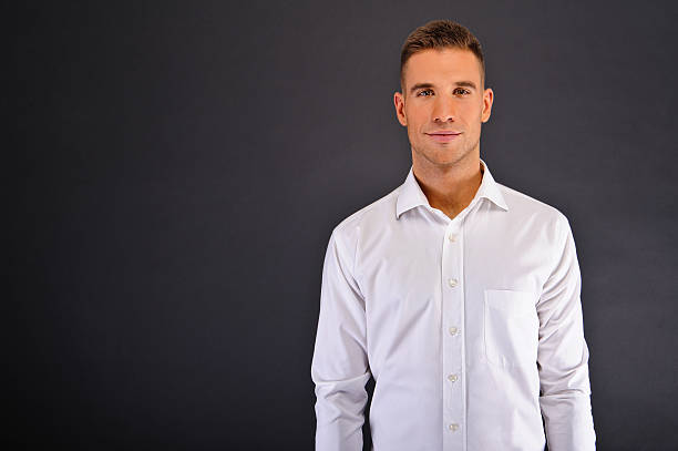 istock Man with white shirt over dark background 178554202