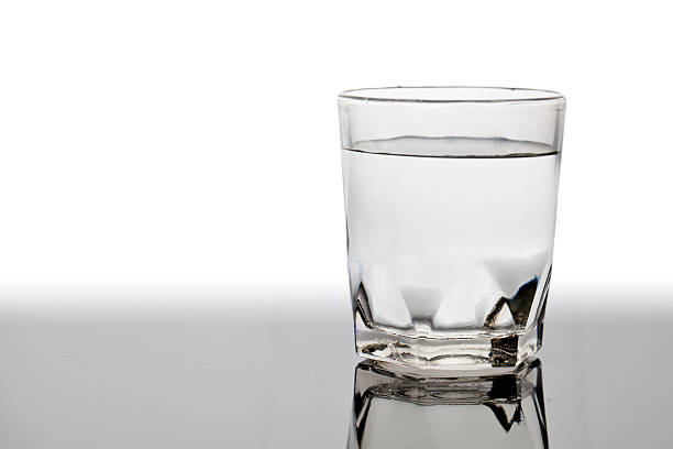 istock Isolated glass of water on the table with reflection 178554298