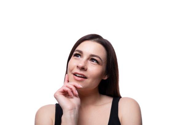 istock Casual young brunette woman daydreaming 1785543580