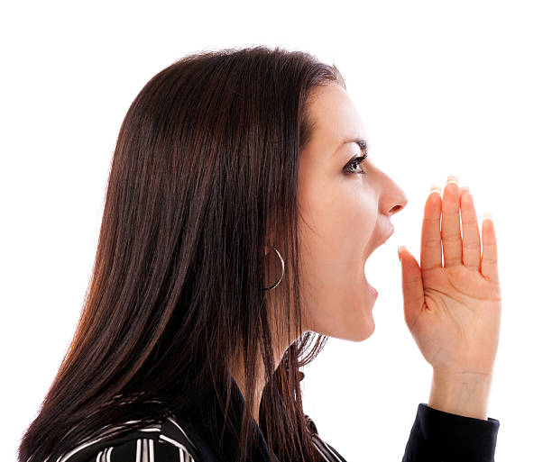 istock Young businesswoman yelling isolated on white background 178555012