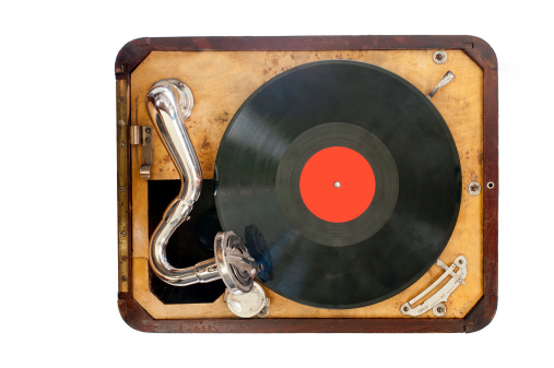 Old gramophone with black vinyl record. view from the top. Isolated object.