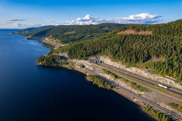 istock Highway and lake from above in Norway 1785558331