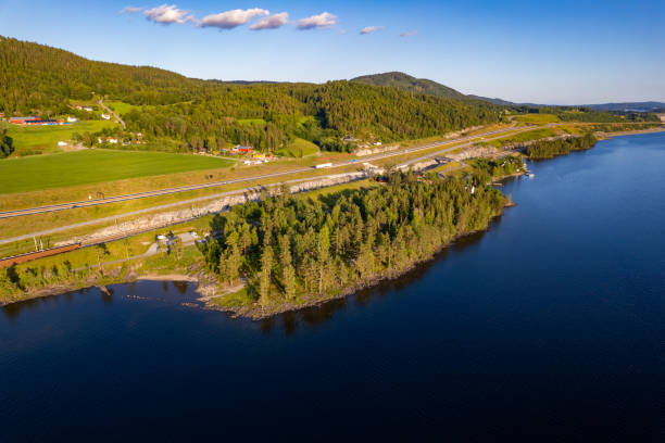istock Highway and lake from above in Norway 1785558332