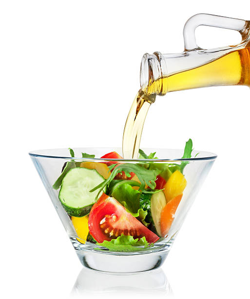 Vegetable salad with olive oil on white background. Clipping path