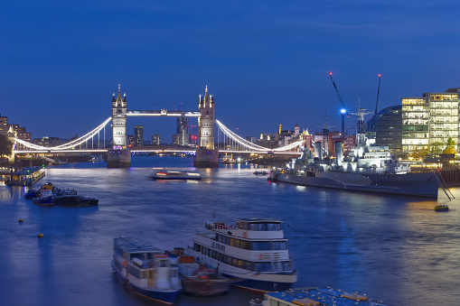 London, UK - 11 09 2023 - Tower Bridge, HMS Belfast and the River Thames in the evening