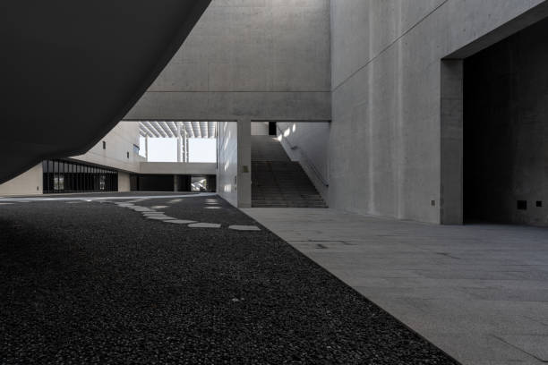 istock The cement walls and empty road of modern minimalist architecture 1785567495