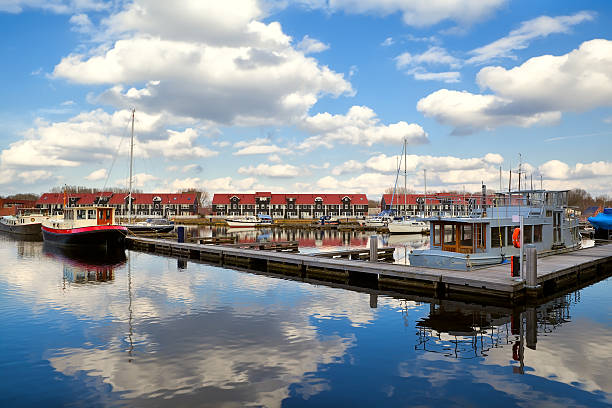 istock harbor at Reitdiephaven with sky reflected in water 178556762