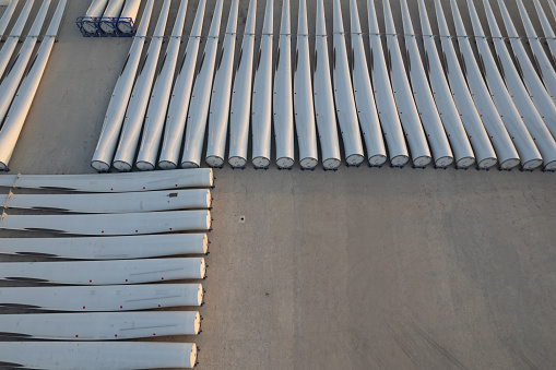 Aerial view of the spiral blades of the wind turbine neatly placed on the site