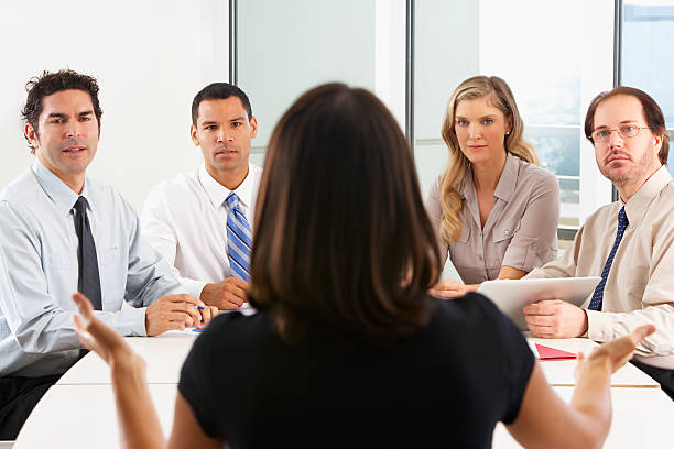 istock View From Behind As CEO Addresses Meeting In Boardroom 178556870