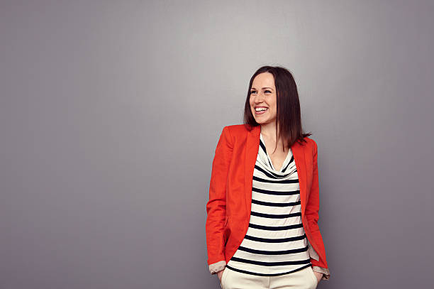 istock woman looking up and laughing 178556886
