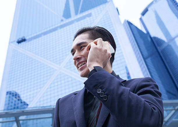 istock Asian business man with smart phone 178557216