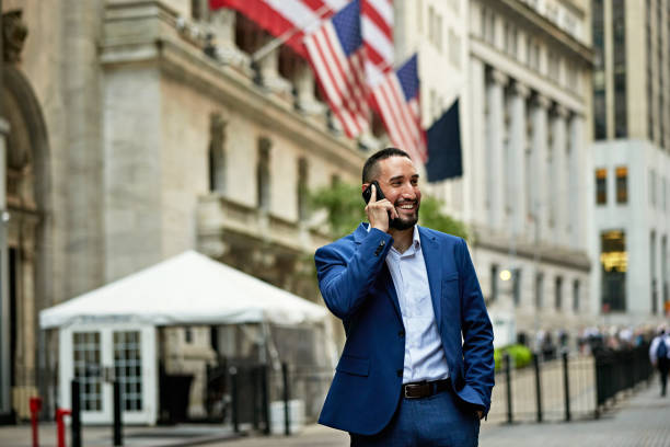istock Cheerful businessman on Broad Street in Lower Manhattan 1785572905