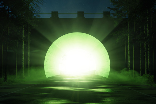 3D rendering of abstract tunnel with bright light and green dust