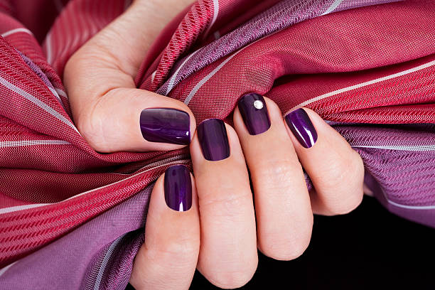 istock Beautiful purple female nails 178557415