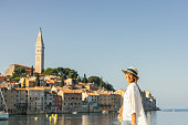 Happy woman traveler in Croatia- Rovinj city and adriatic sea-Istria