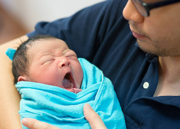 istock Asian father and newborn baby 178557750