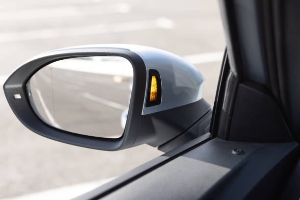 istock System blind spots of the car. Detail of side keeping assist system switch button. Blind zone monitoring sensor on the side mirror of a modern electric car 1785580088