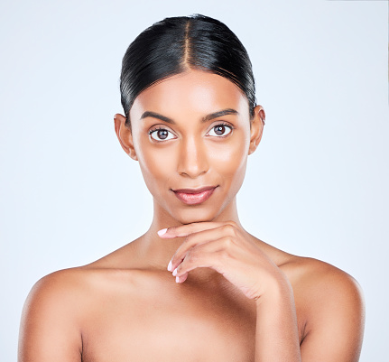 Studio portrait of Indian woman for dermatology, skincare and cosmetics for salon aesthetic. Beauty, spa and face of isolated person for wellness, satisfaction and facial glow on white background