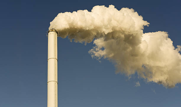 Smoke In The Air Smoke in the air.Chimneys at a factory producing sugar from sugar beets.More 'Smoke in the air': hott stock pictures, royalty-free photos & images