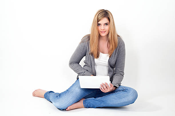 istock young woman working on laptop 178559040
