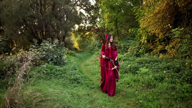 Magical Woman With A Bow And Arrow In The Forest