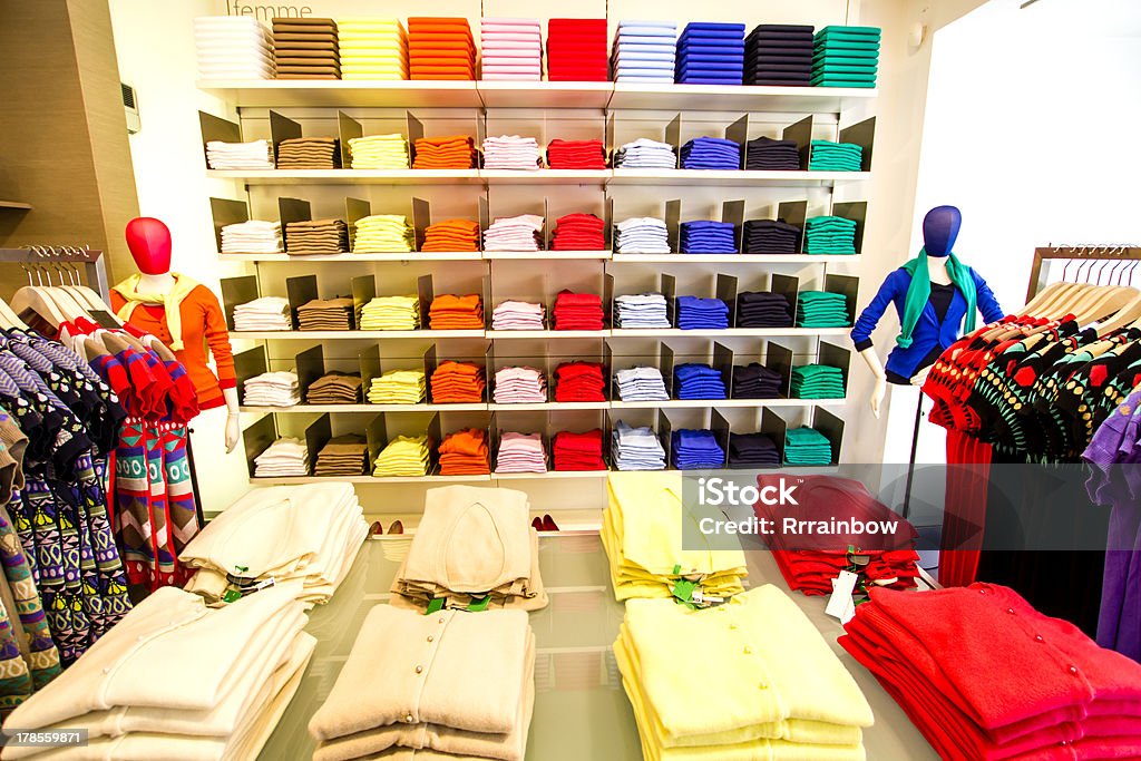 Clothing section in the department store Folded clothes in the department store Clothing Store Stock Photo