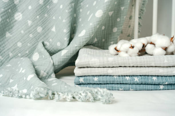 istock Stack of cotton blankets for a newborn in a cradle 1785604826