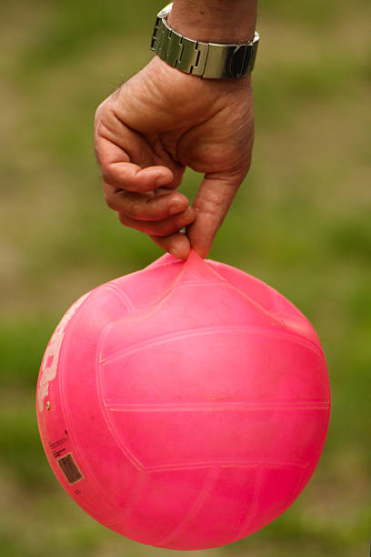 istock Pink ball brought with two fingers 178560883
