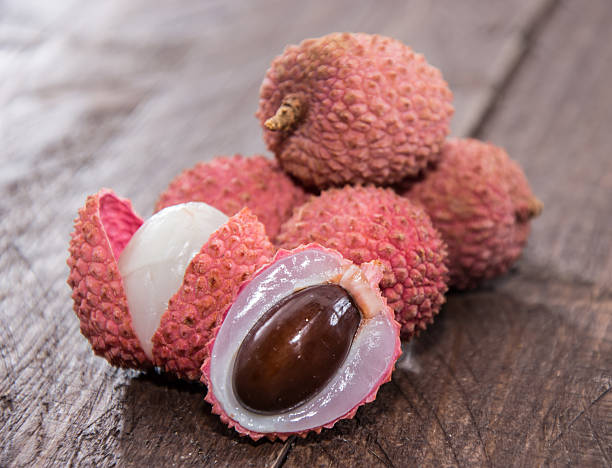 istock Fresh Lychees on wooden background 178560967
