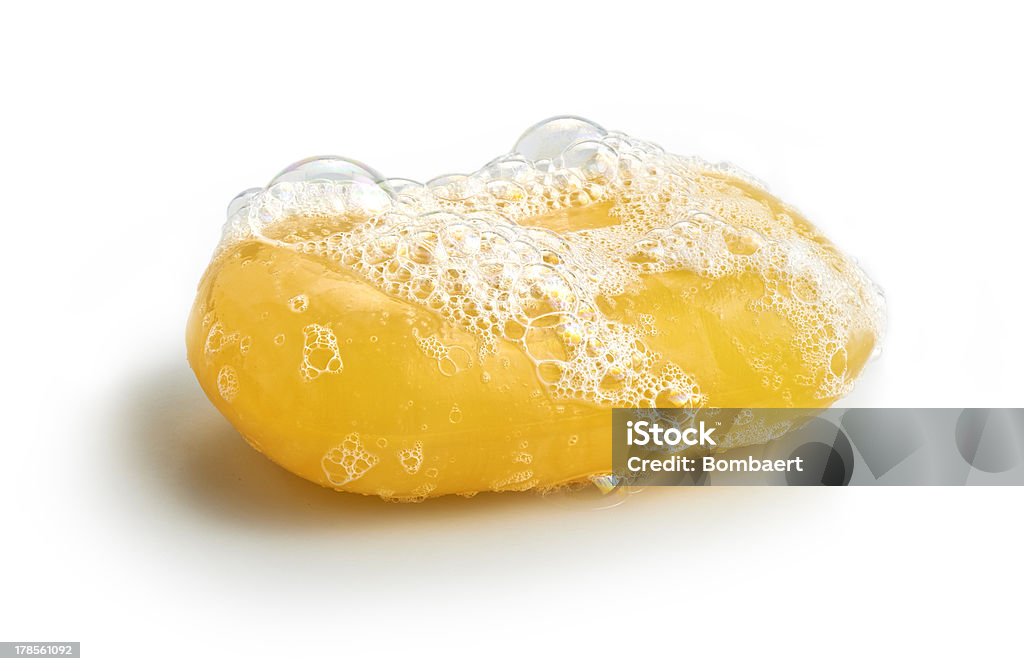 Yellow soap bubble Yellow soap bubble of isolation on a white background Soap Sud Stock Photo