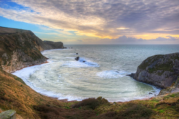 istock Vibrant sunrise over ocean and sheltered cove 178561400