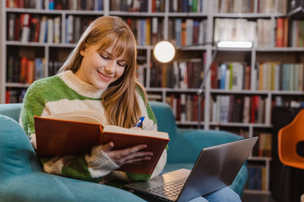istock Young female University student studying in the library 1785614729