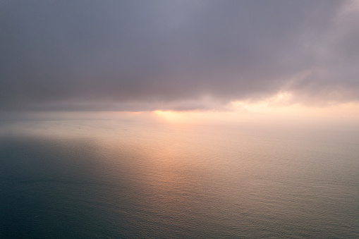 Islands, reefs, and clouds at sunrise