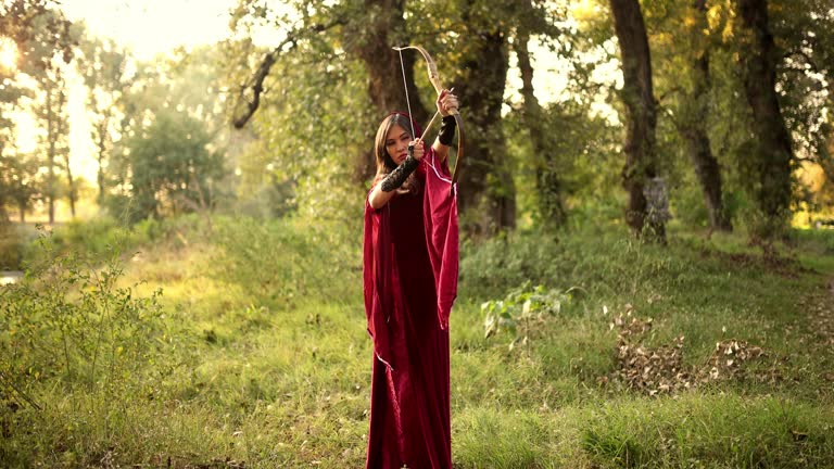 Magical Woman Firing The Arrow In The Forest